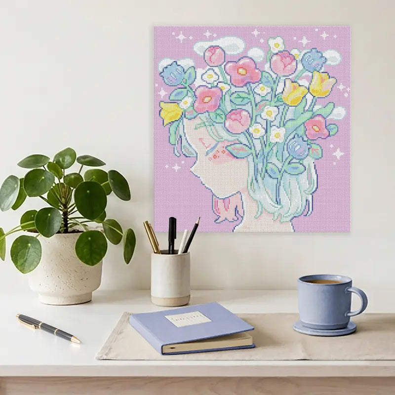 Diamond Painting mit Mädchenkopf mit Blumen und zarten Pastellfarben als Diamond Painting Deko an der Wand